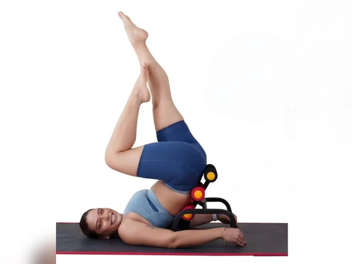 A person with hips raised on the Magic BB frame at its gentle setting, shoulders and head resting on the mat, legs lifted