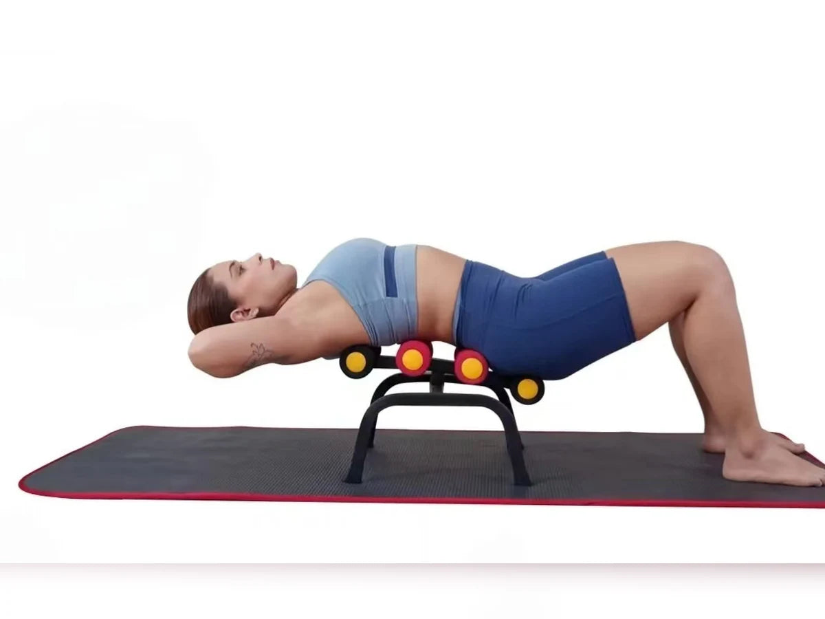 A person lying level over the Magic BB frame in a full flat stretch, feet on the floor