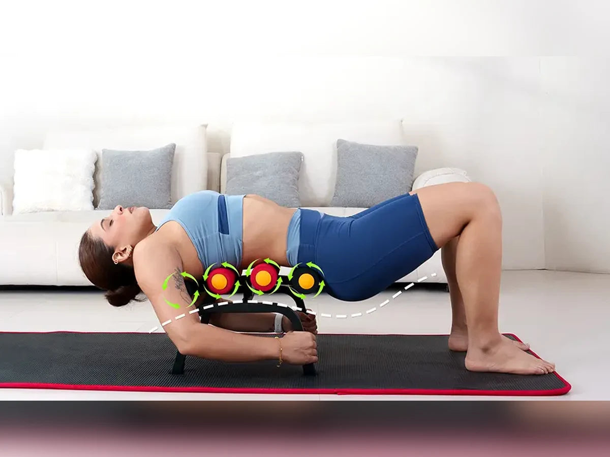 A person arching deeper over the Magic BB frame, head dropped back toward the mat, feet planted
