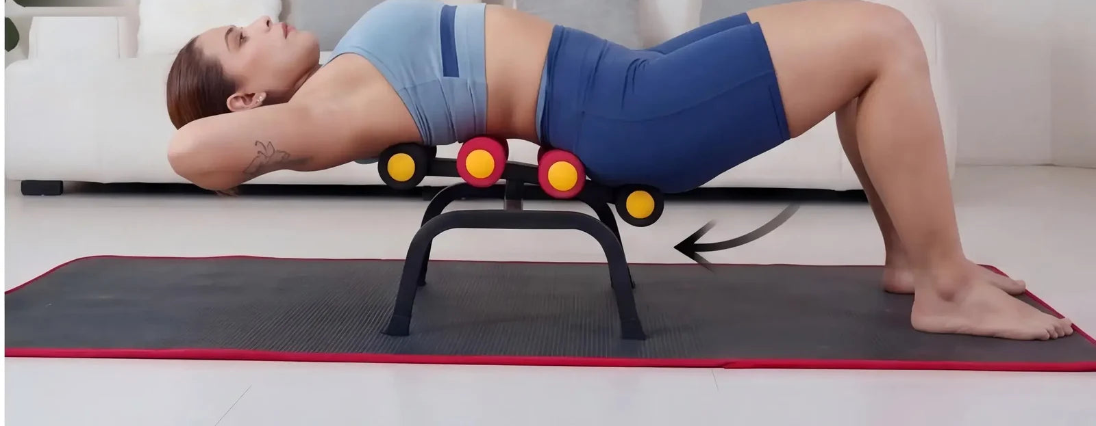 A person rocking over the Magic BB frame in a supported bridge, feet planted on the mat